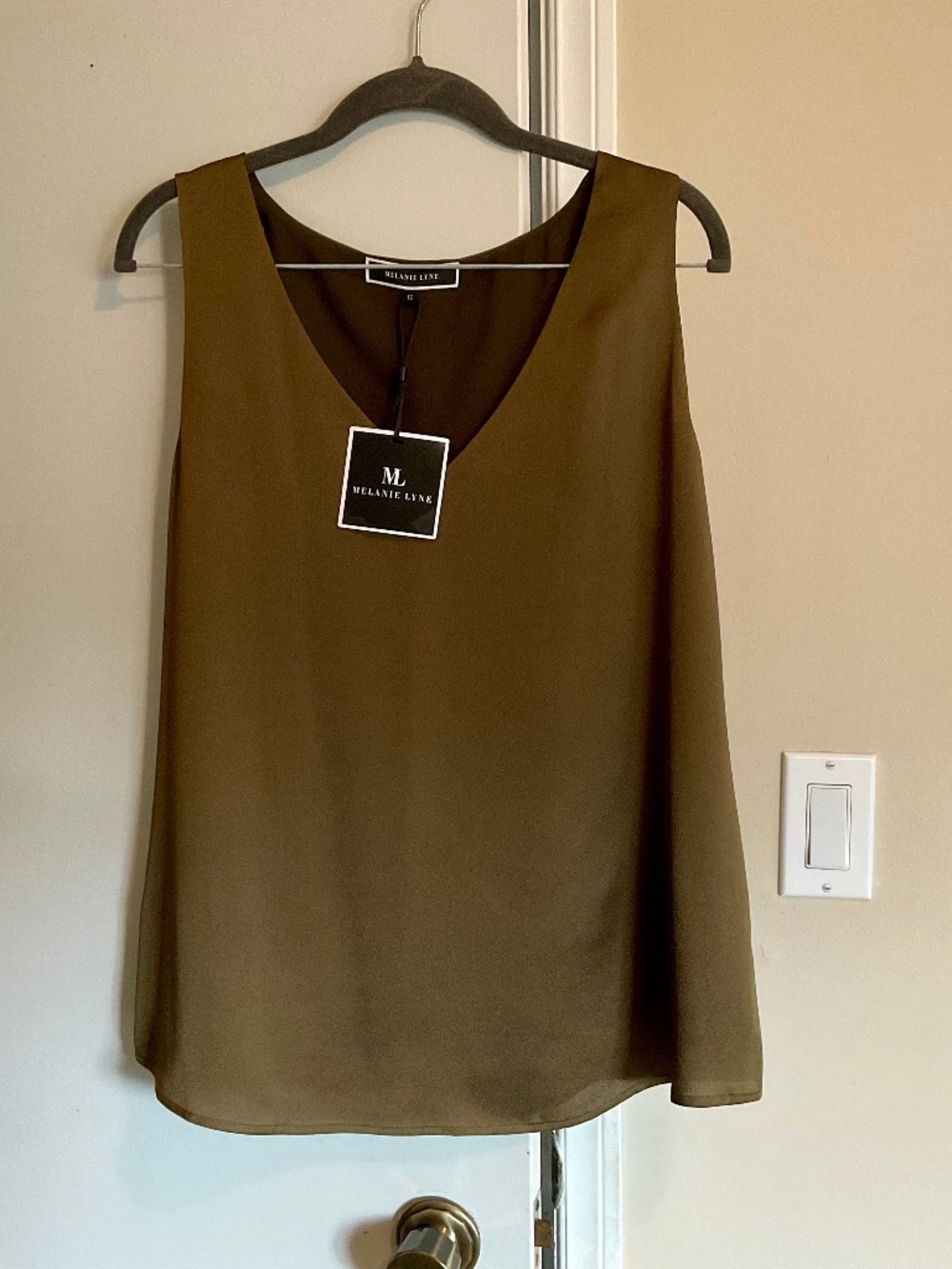 Sleeveless women’s top satin like fabric dark khaki green size 12. NWT